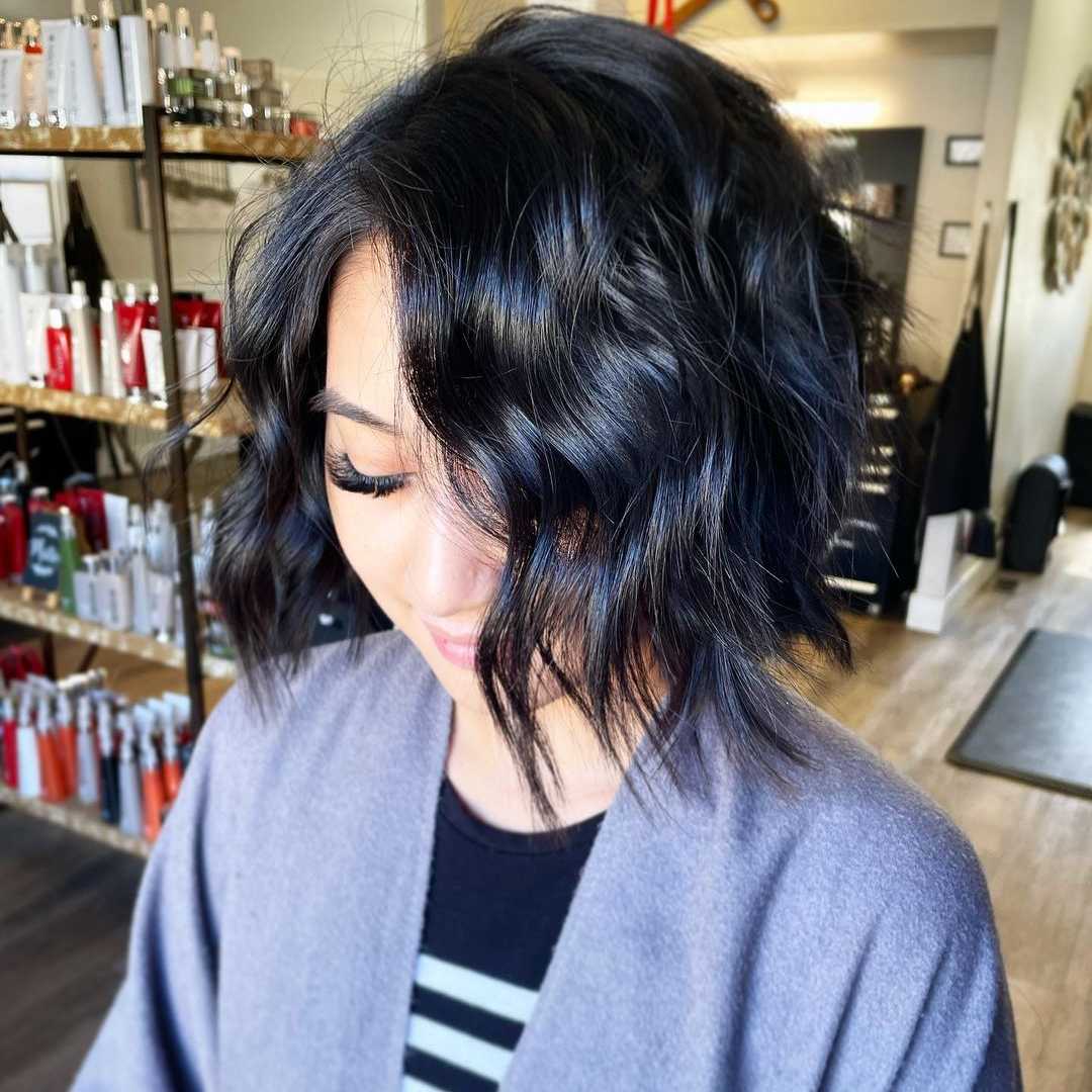 intense black hair color on a trendy medium bob cut