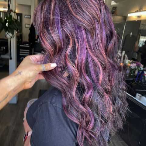 vivid plum hair color with added purple highlights